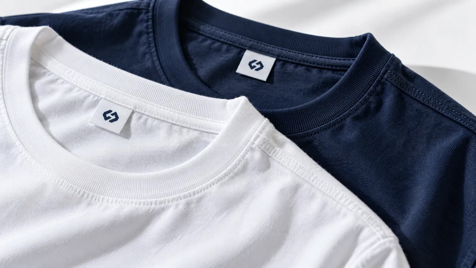 Close-up of a cotton T-shirt's knit, ribbed neckband and stitching